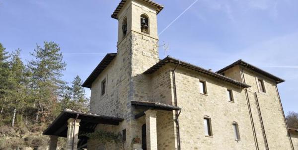 Sanctuary of the Madonna dei Rimedi with woodland in the background.